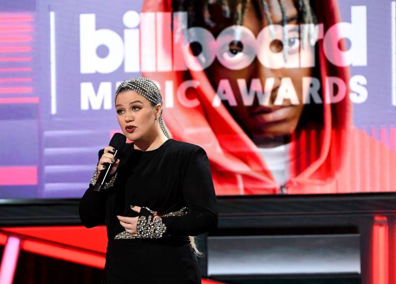 FILE PHOTO:  In this image released on October 14, Kelly Clarkson speaks onstage at the 2020 Billboard Music Awards, broadcast on October 14, 2020 at the Dolby Theatre in Los Angeles, CA.  The 2021 awards show will be held in May. (Photo by Kevin Winter/Getty Images)