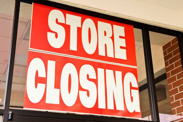 Express files for bankruptcy, to close about 100 stores