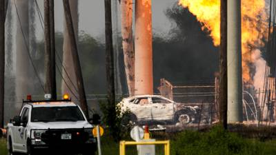 Roaring pipeline fire near Houston subsides but still burns