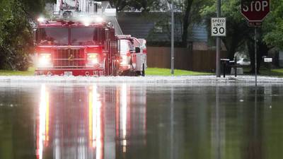Heavy rains near Houston close schools and flood roadways as officials urge residents to evacuate