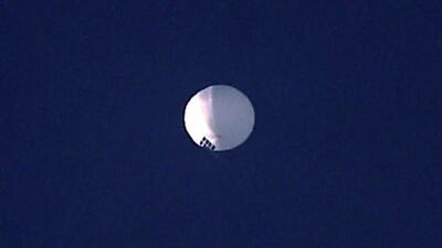 Chinese spy balloon the size of 3 school buses flies over US as government leaders decide its fate