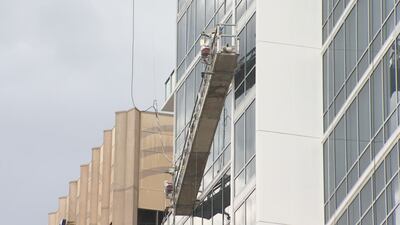 Stranded window washers escape to balcony of downtown Orlando high-rise amid severe weather