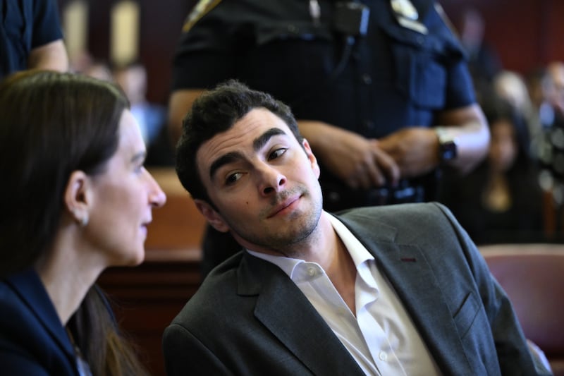 Police video shows Luigi Mangione said he didn't want to talk. They kept asking questions