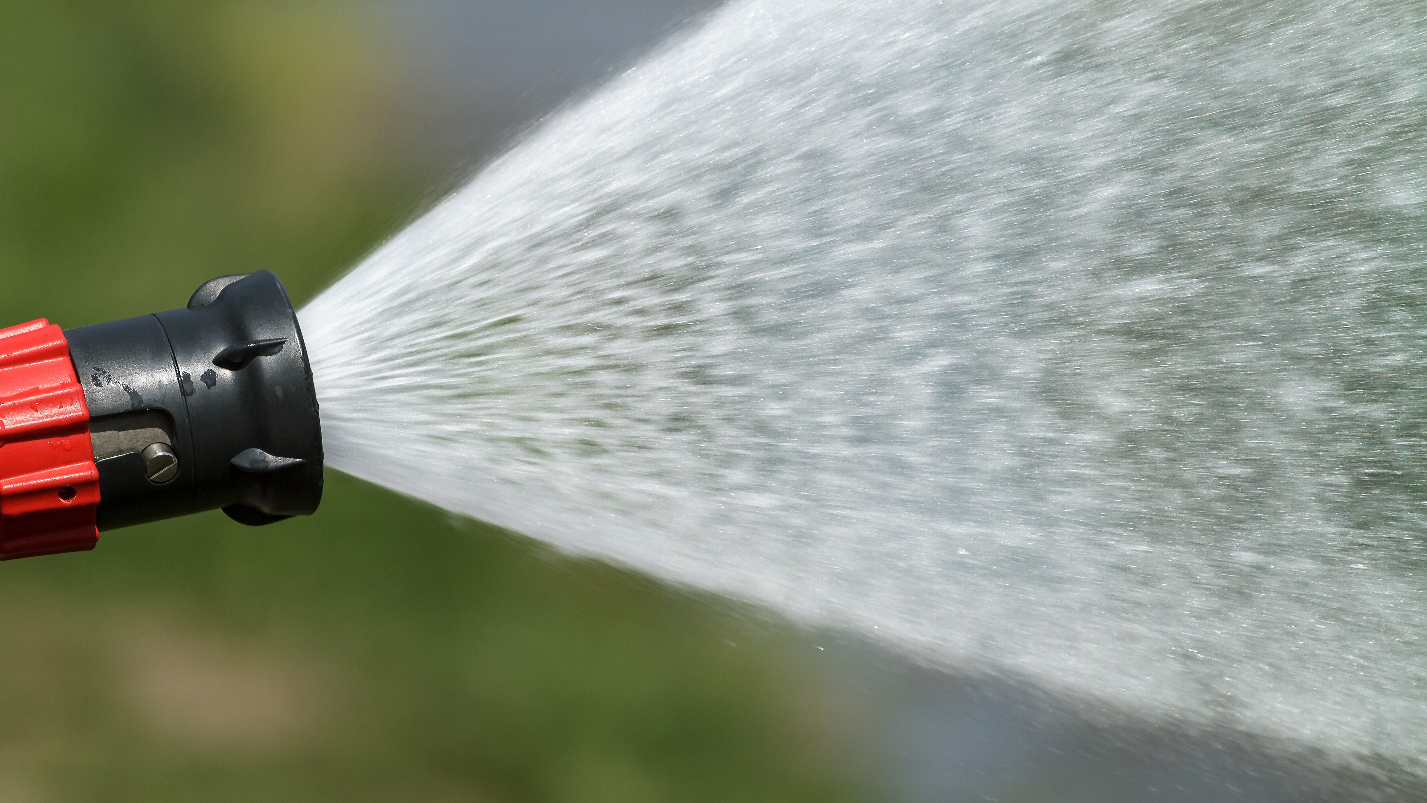 stream of water from a fire hose